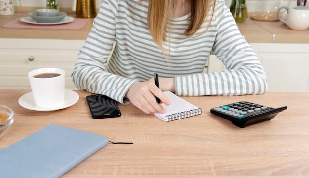 A person using a calculator to calculate the loan amount and other expenses with a pen and notebook on the table