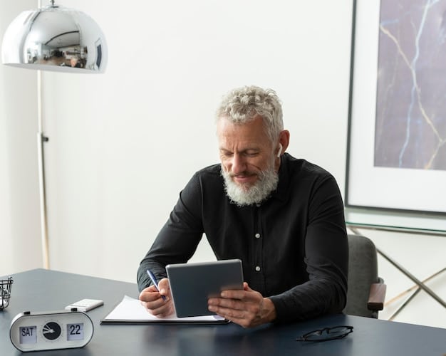 A person wearing a suit, sitting at a desk and reviewing retirement investment options on a tablet. The person looks focused and determined, suggesting careful planning and financial literacy.